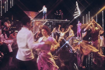 Clubbers on the dancefloor in an unspecified nightclub, location unspecified, circa 1975
