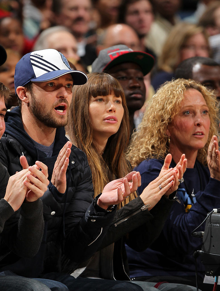 the two court side, clapping during a game