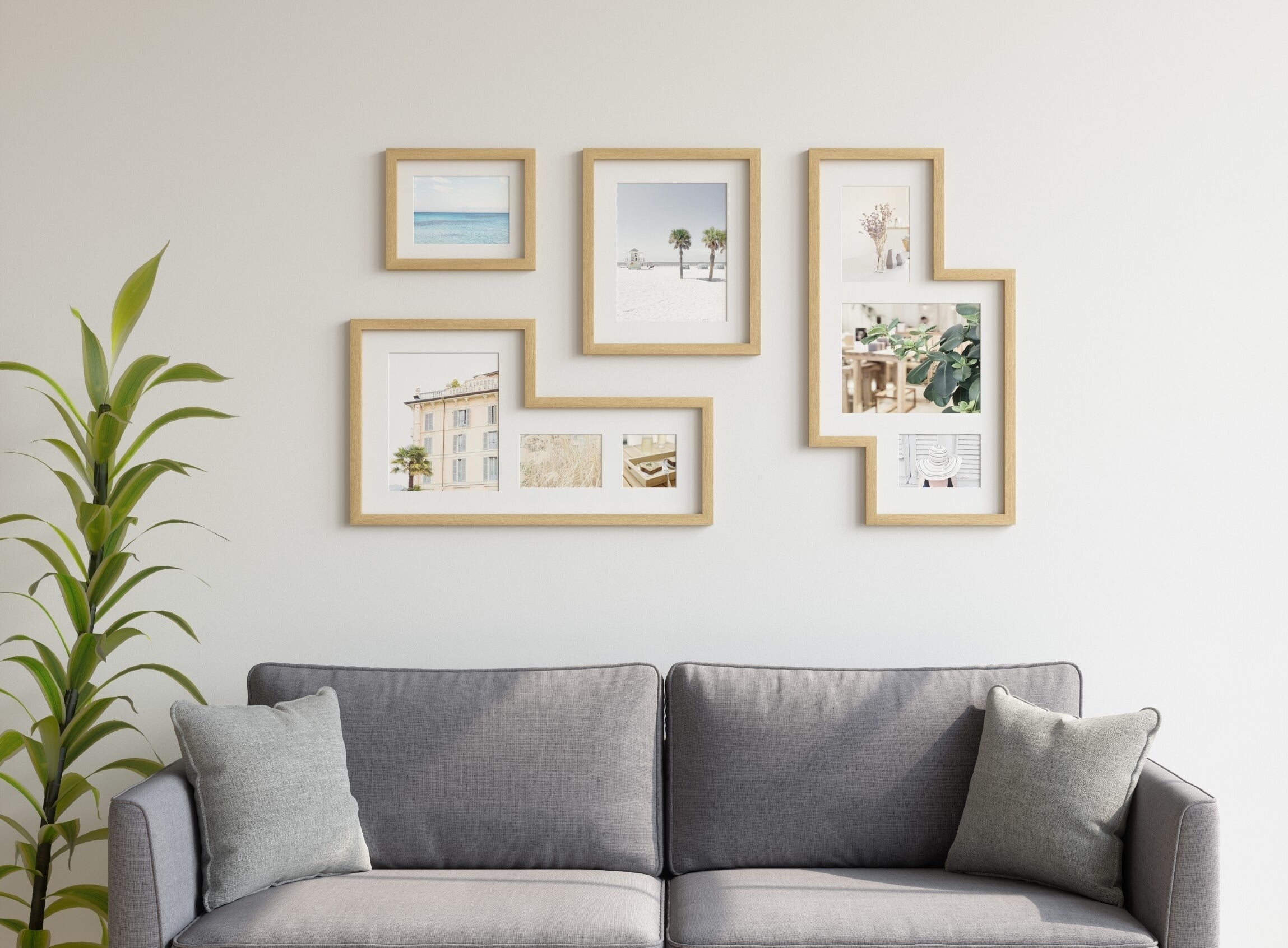 A set of irregularly-shaped gallery wall picture frames hung above a sofa
