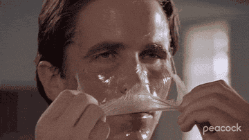 GIF patrick bateman pulling face mask off