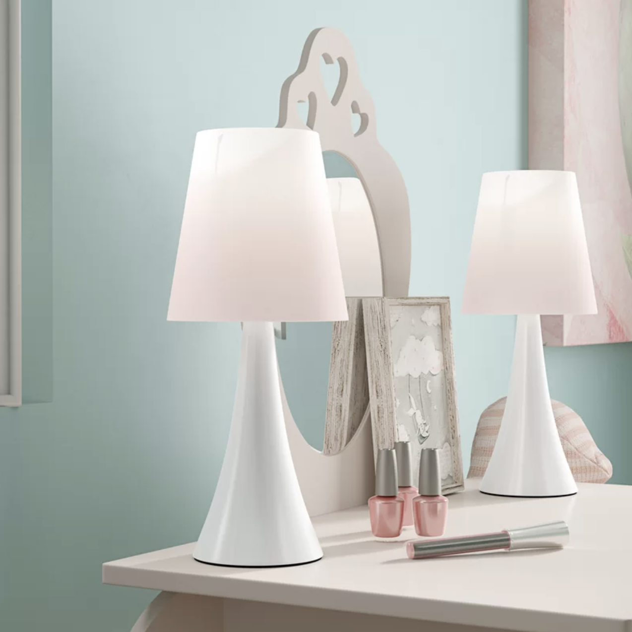 a pair of slim lamps with matching shades on a vanity