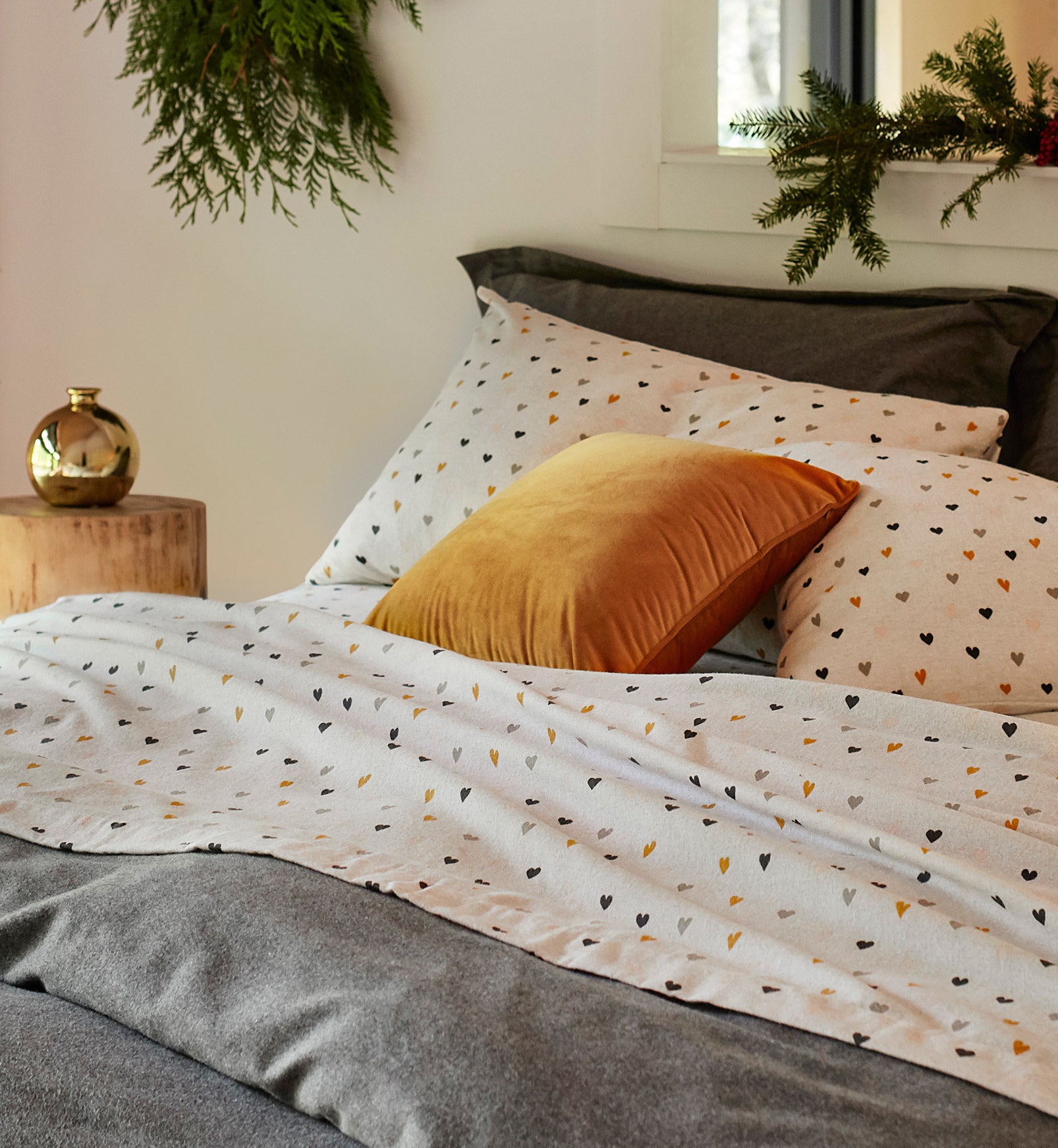 a set of soft flannel sheets on a neatly made up bed