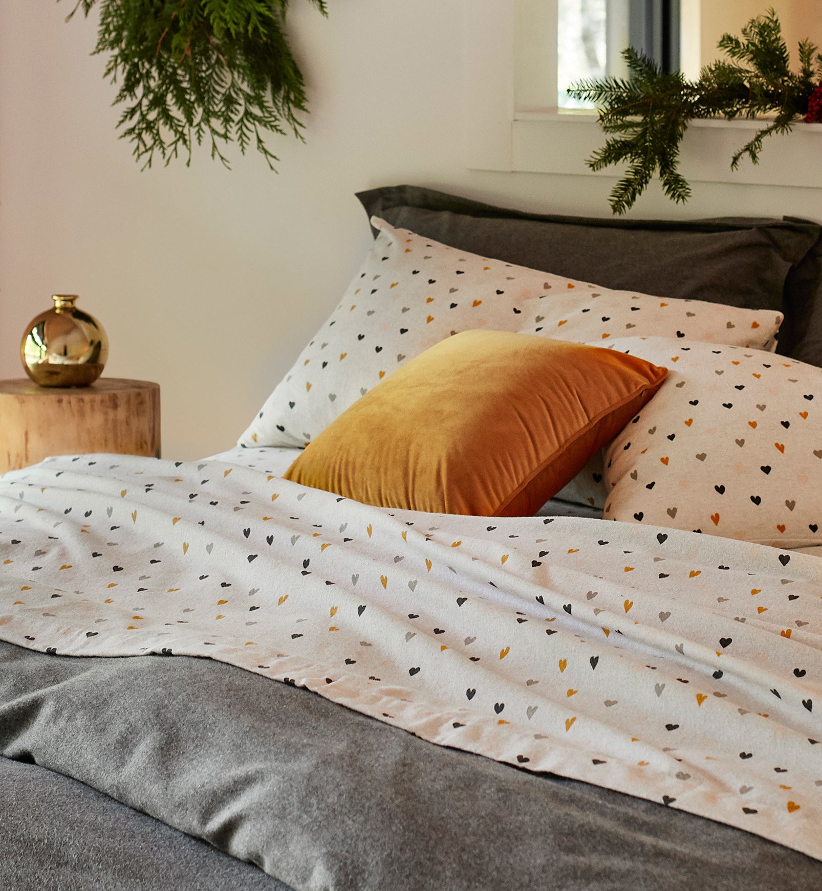 a set of soft flannel sheets on a neatly made up bed