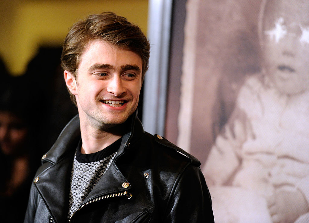 Daniel Radcliffe looking to the side and smiling