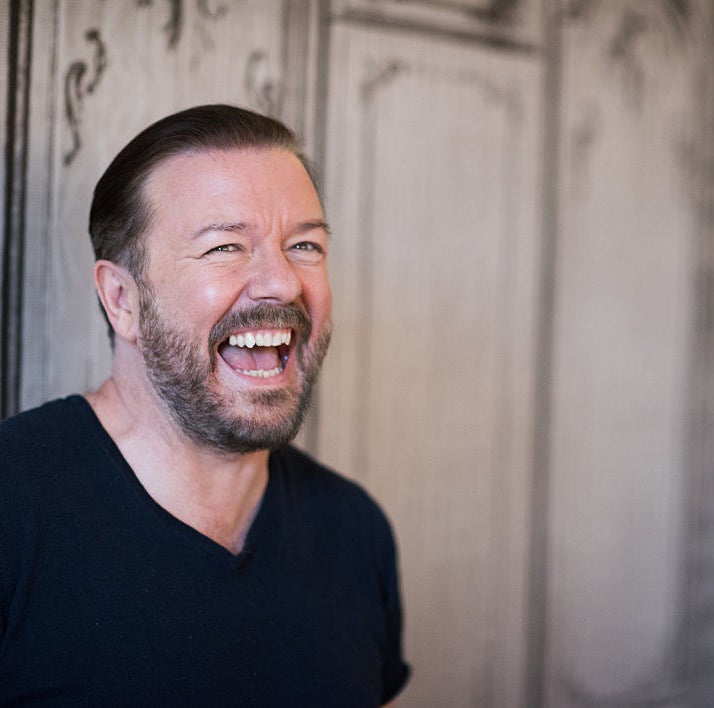 A closeup of Ricky Gervais laughing