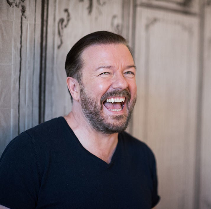 A closeup of Ricky Gervais laughing