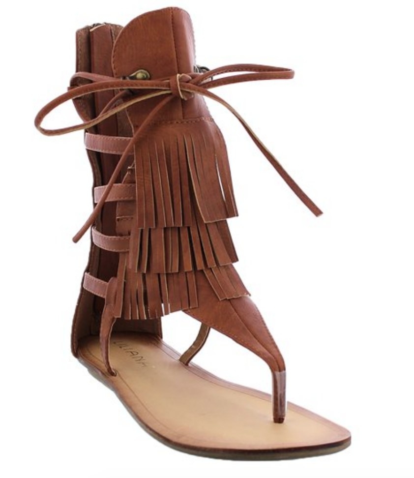 A pair of brown gladiator flat sandals