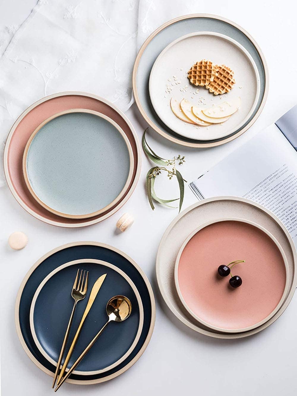 a set of dinner plates in different colours on a neat tablescape