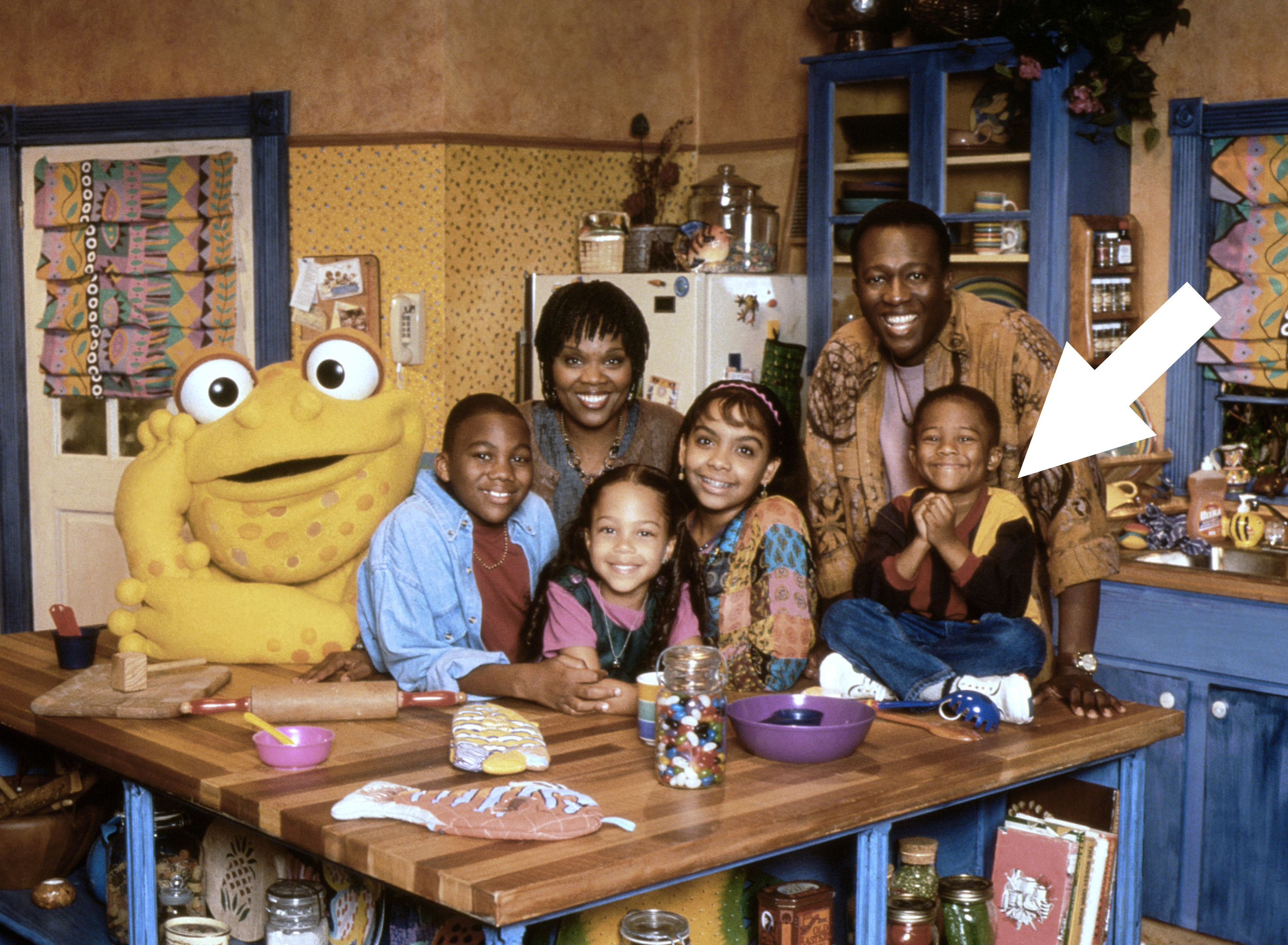 The main cast of Gullah Gullah Island, with an arrow pointing to Simeon, who is also looks very young