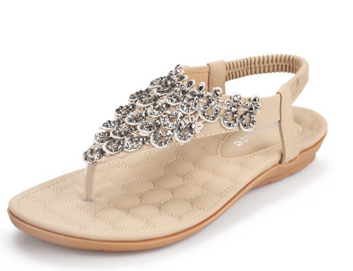 A beige thong sandal with jewels