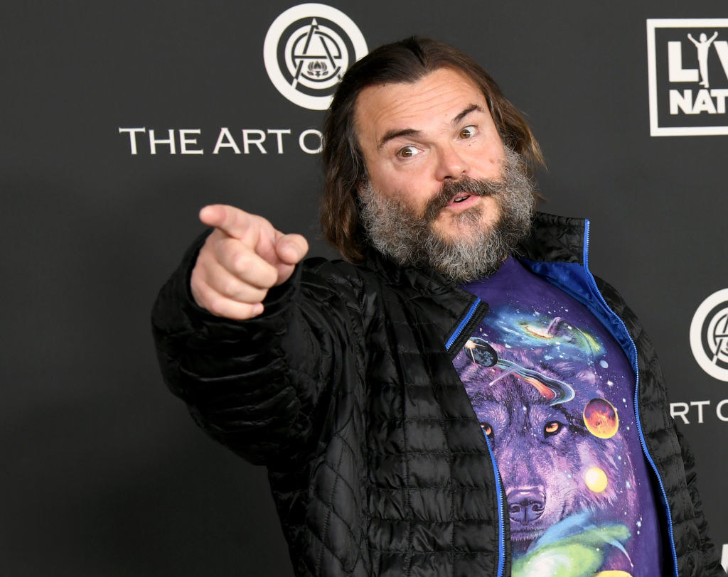 Jack Black points to someone at an event