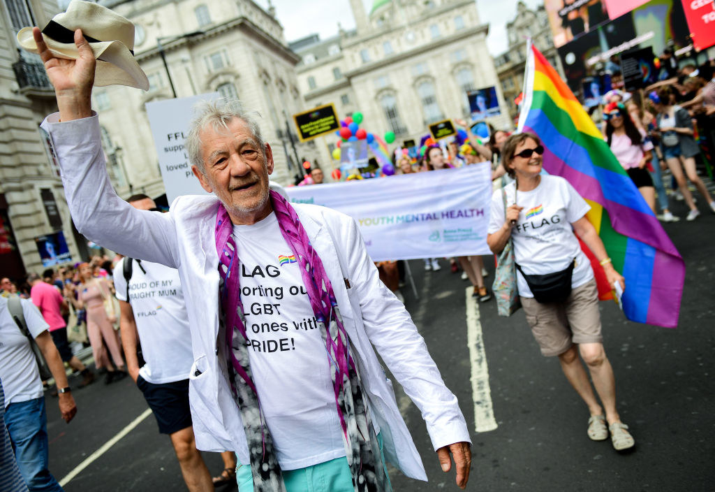 Ian McKellen walks at a Pride parade