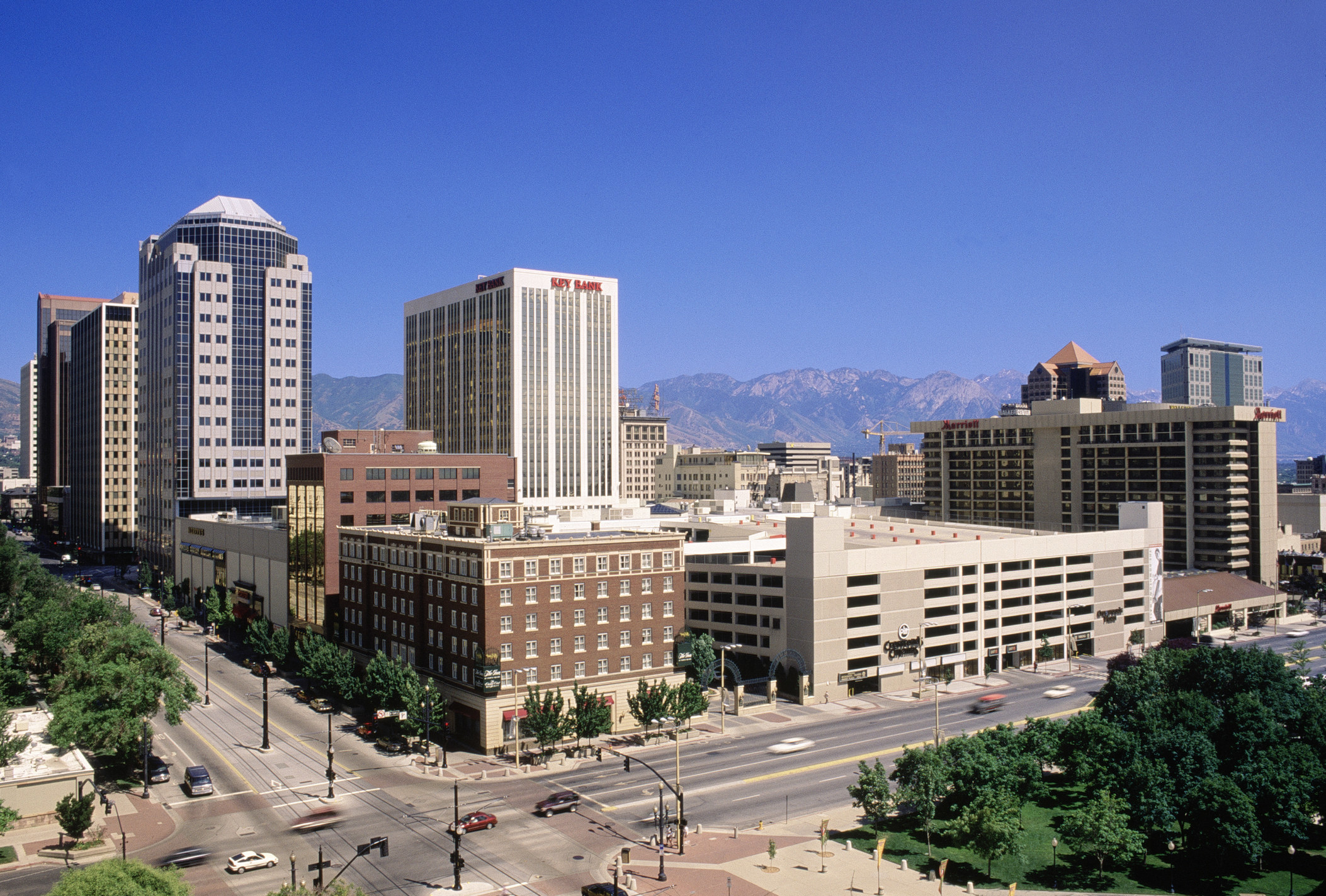 a city downtown with views of the mountains in the back