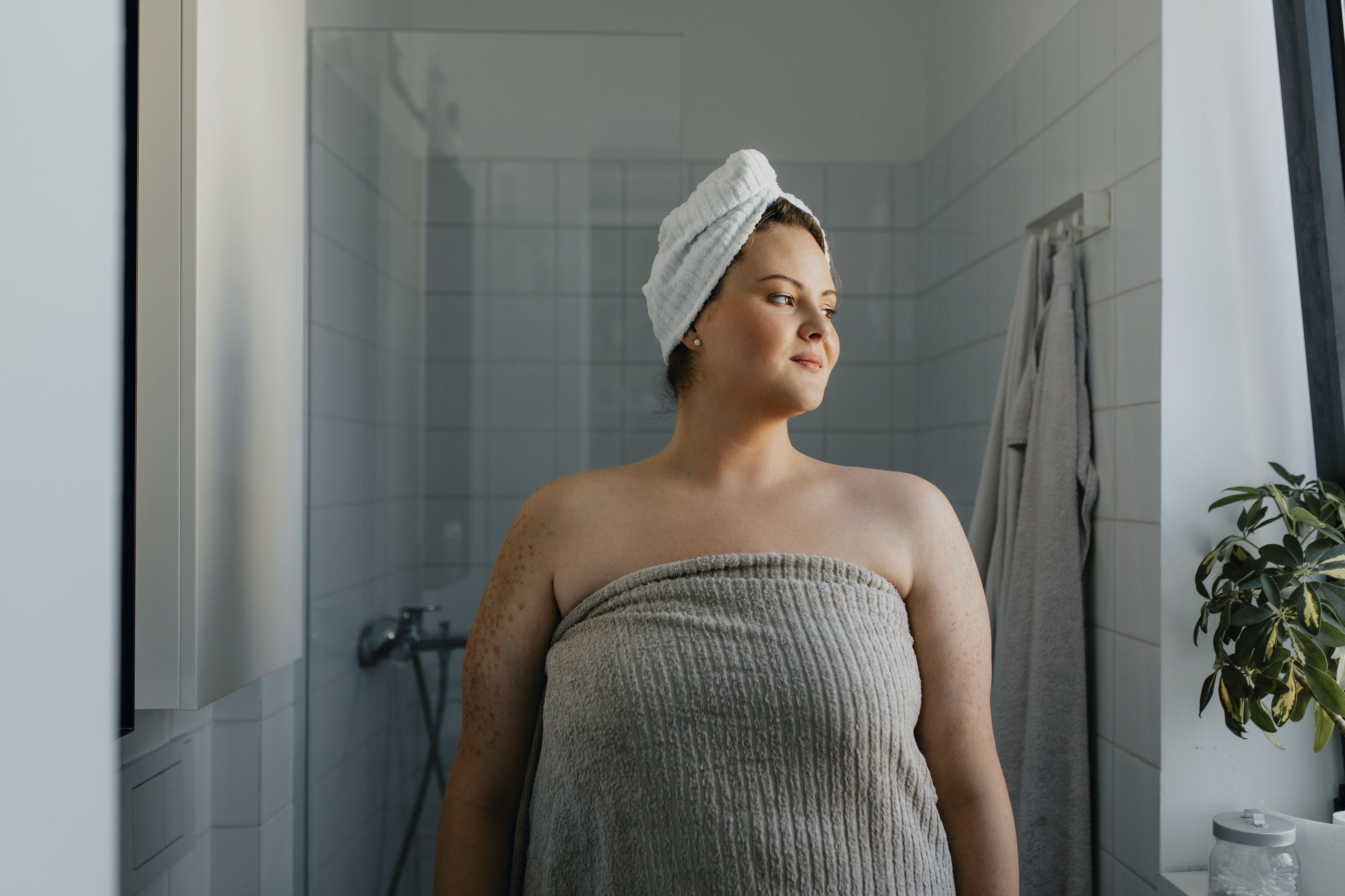 A woman in a towel after a shower