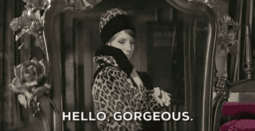 A gif from funny girl of fanny bryce saying &quot;Hello gorgeous&quot;