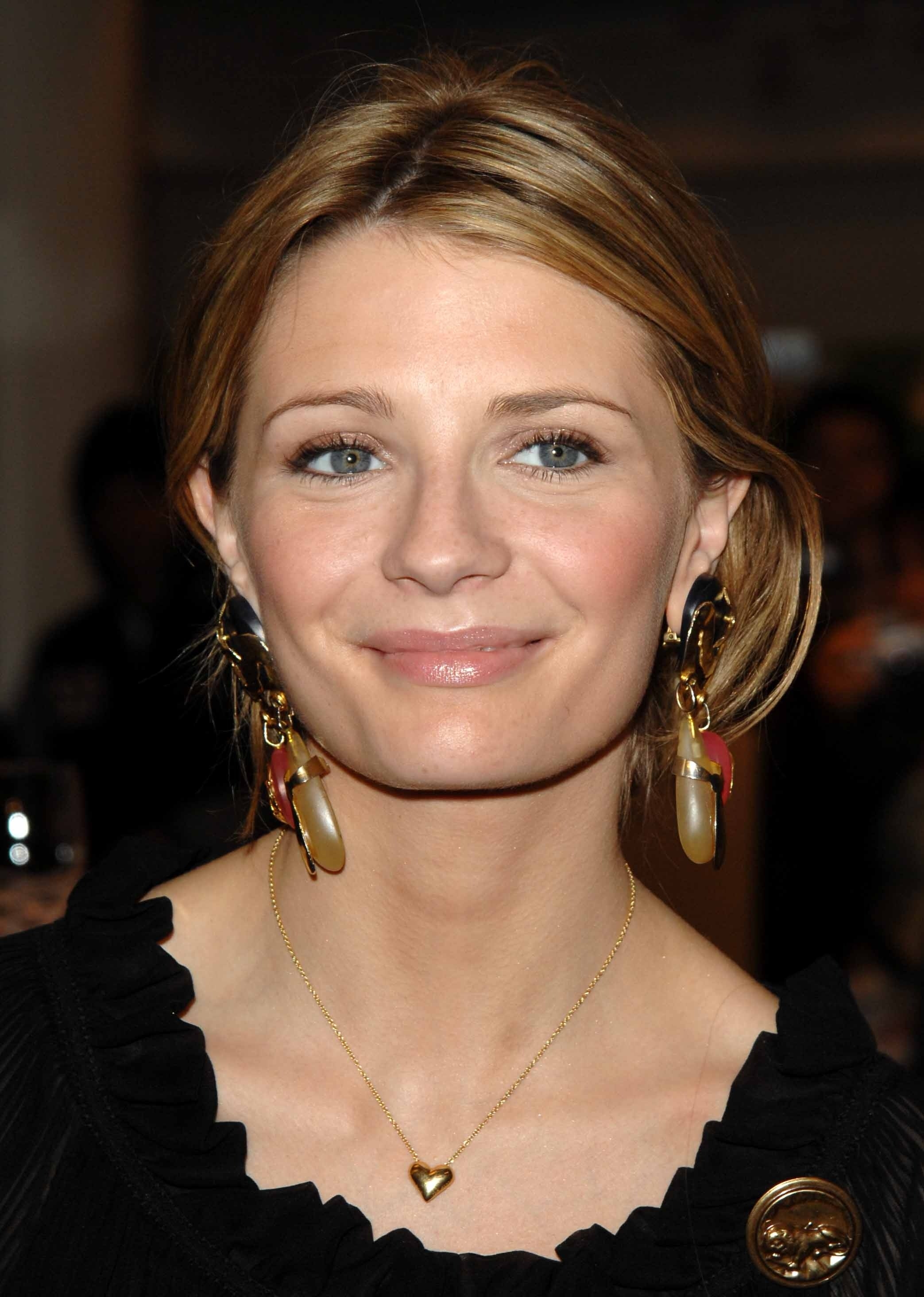 mischa barton smiling at an event