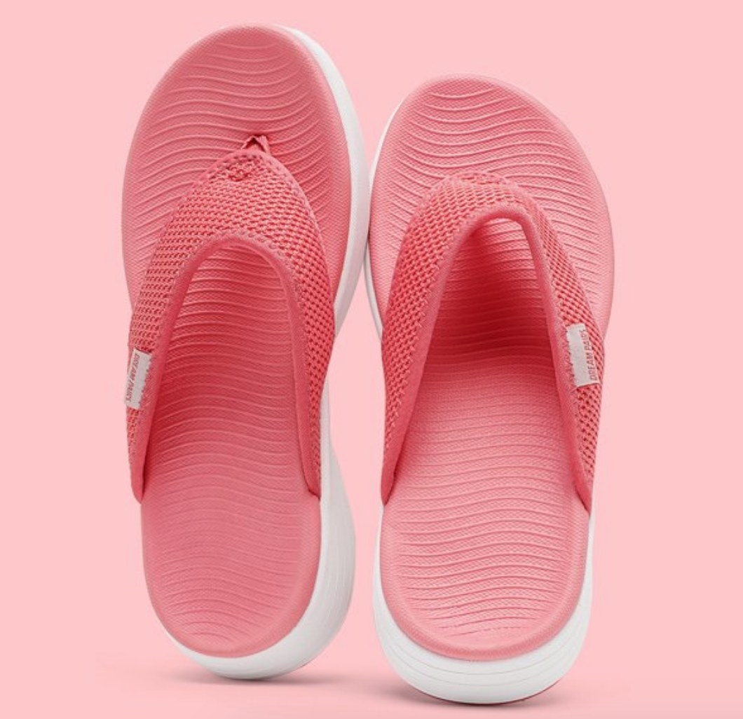 A pair of cushioned pink flip flops