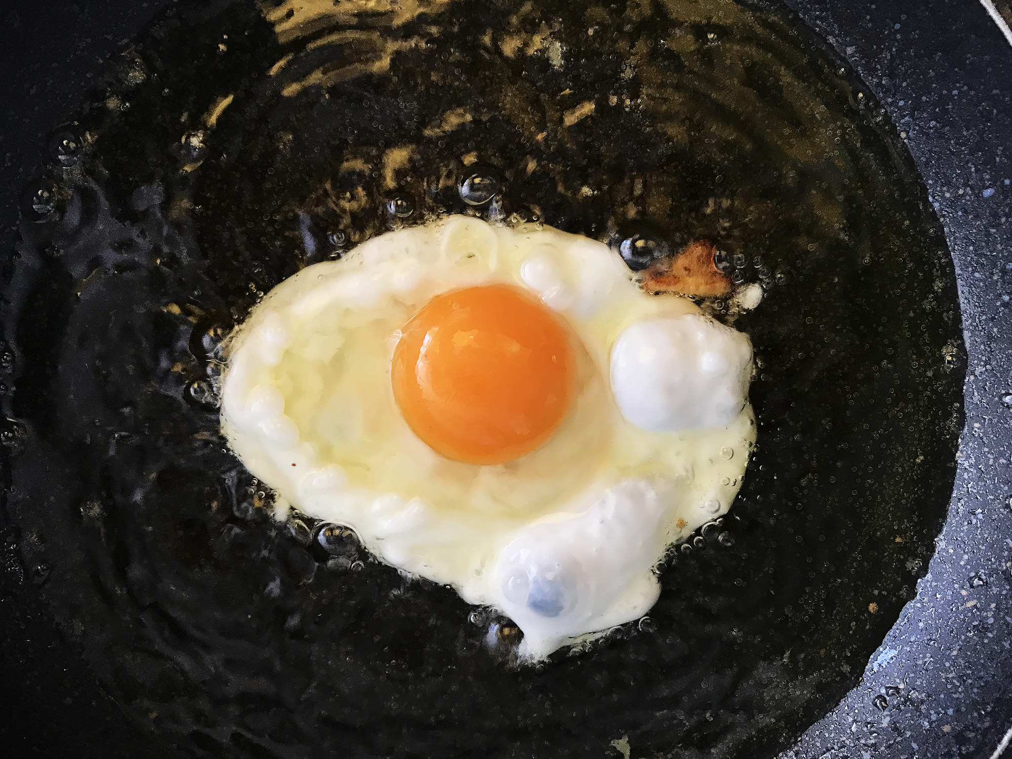 A fried egg cooking