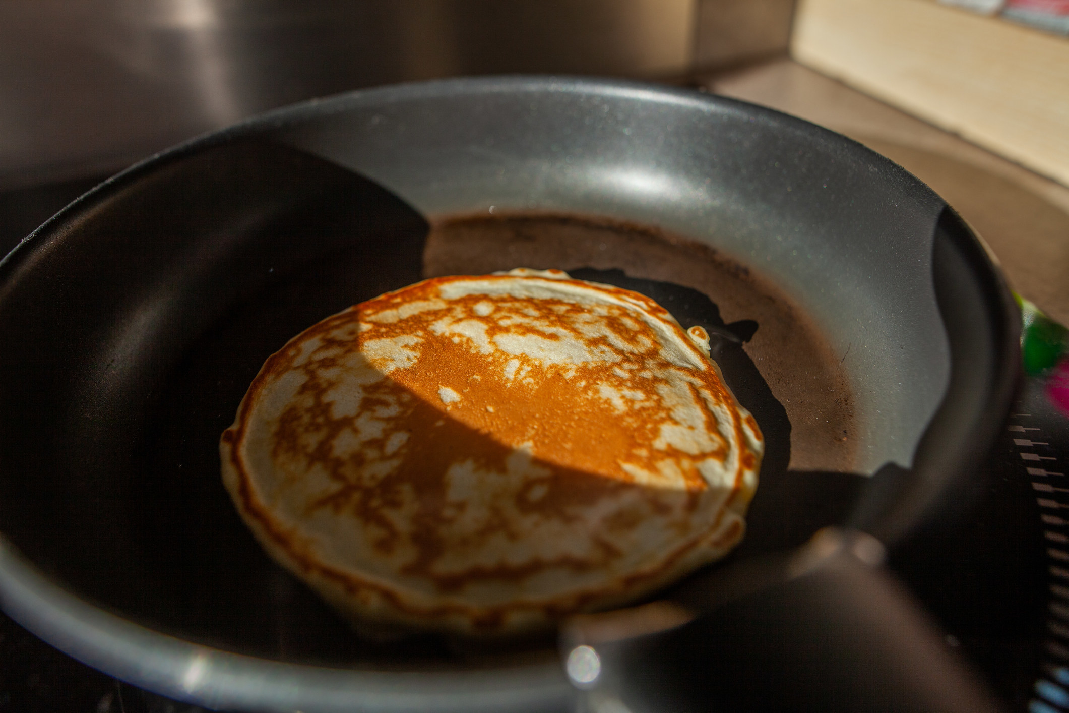 A pancake cooking in a pan