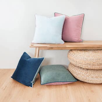 a set of four pillows in an alternate color scheme