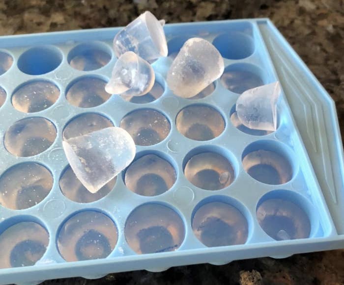reviewer photo showing the mini ice cube tray filled with cubes and a few popped out on top