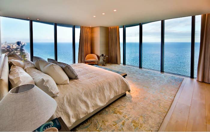 A penthouse condo bedroom with an ocean view