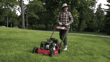 A person mowing lawn