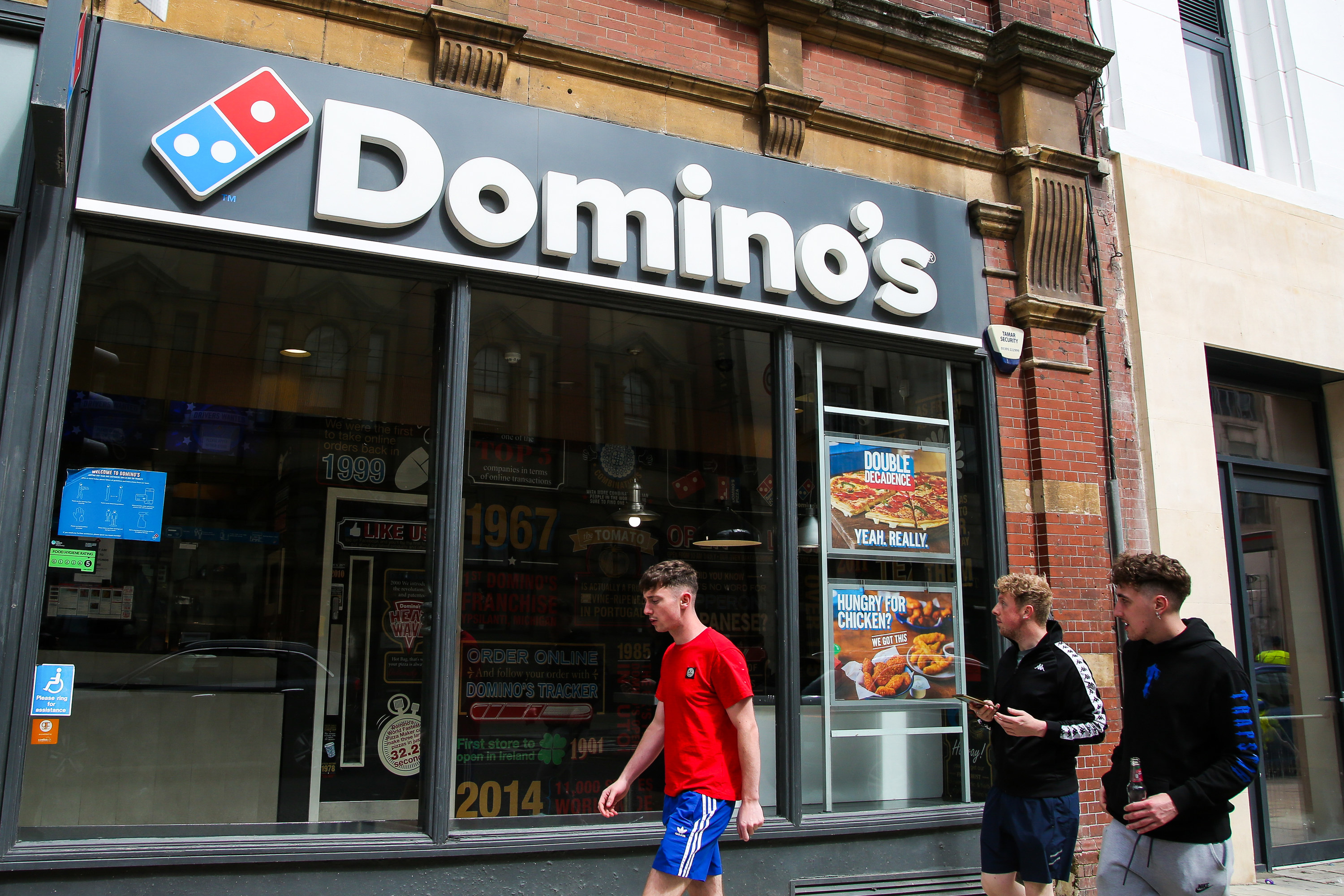 The exterior of a Domino&#x27;s pizza store