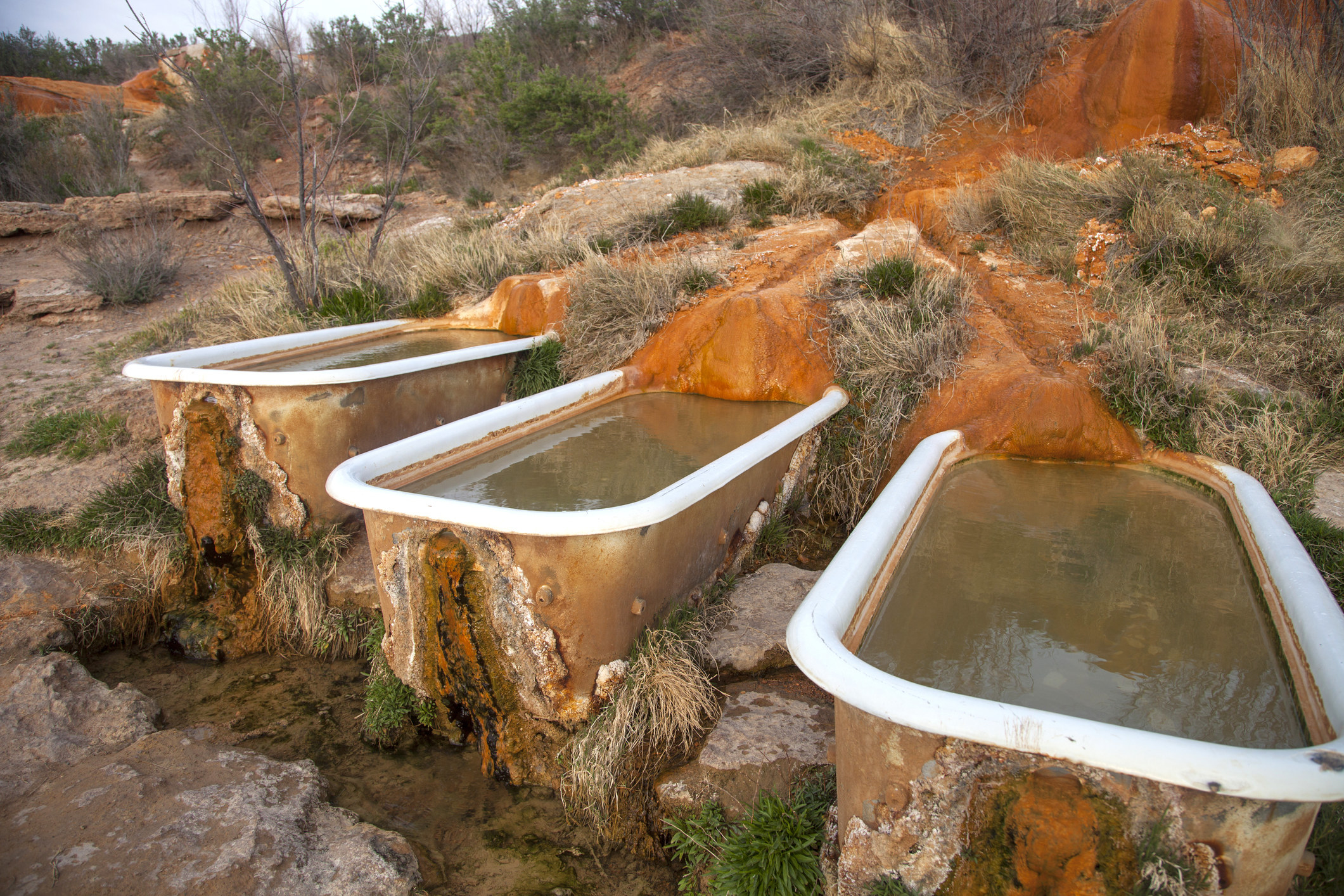Bath tubs built into rock.