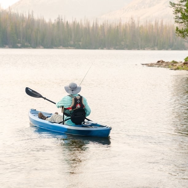 An image of a blue fishing kayak with paddle included