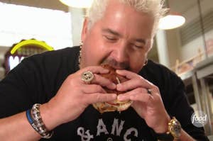 Guy Fieri eating a burger