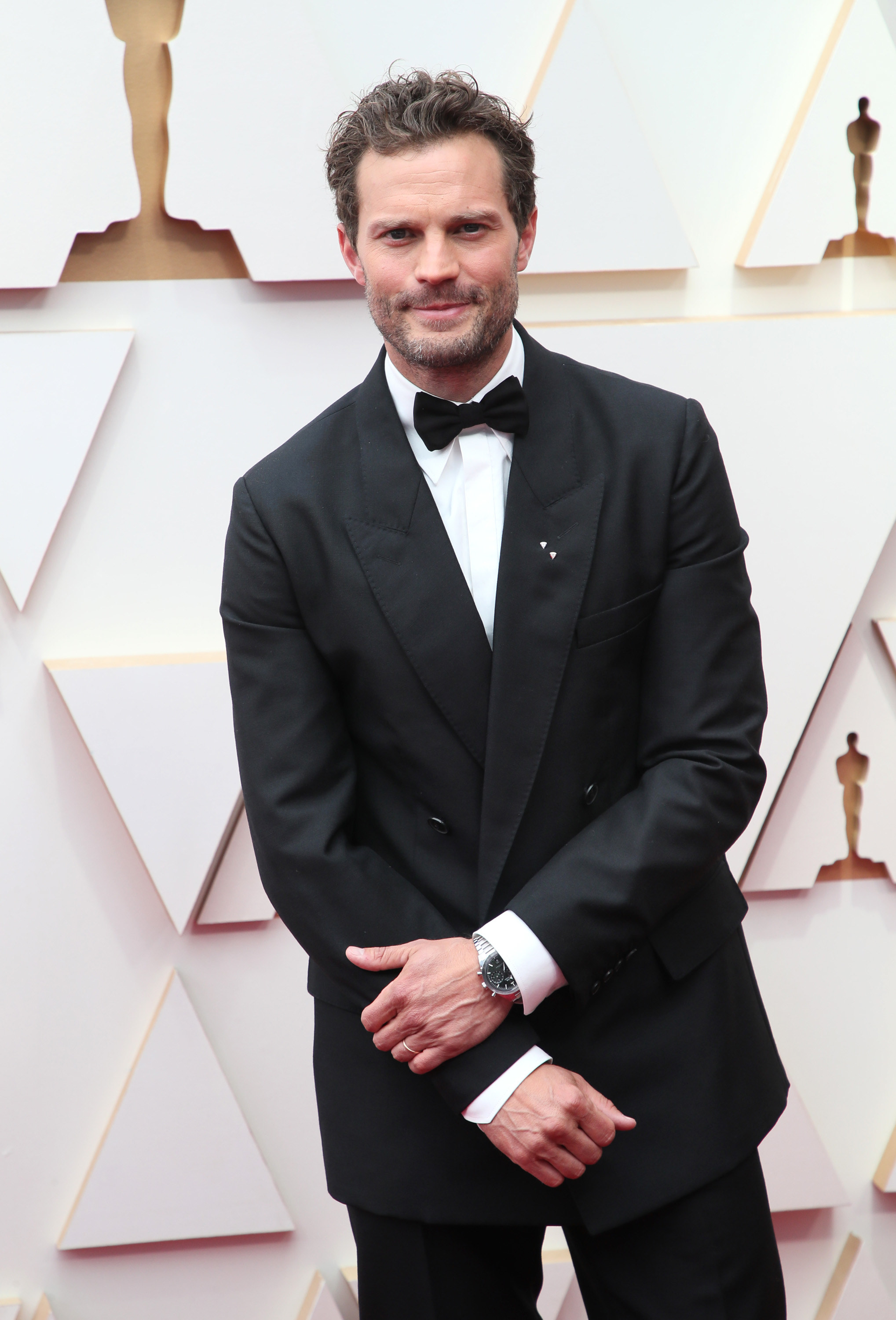 Dornan wearing a suit on the red carpet