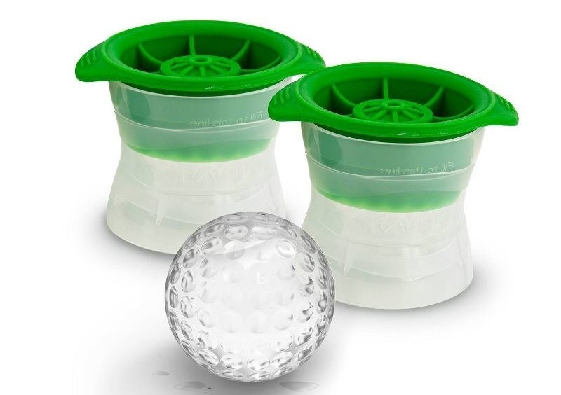 The two green-topped molds with a clear golf ball shaped ice cube