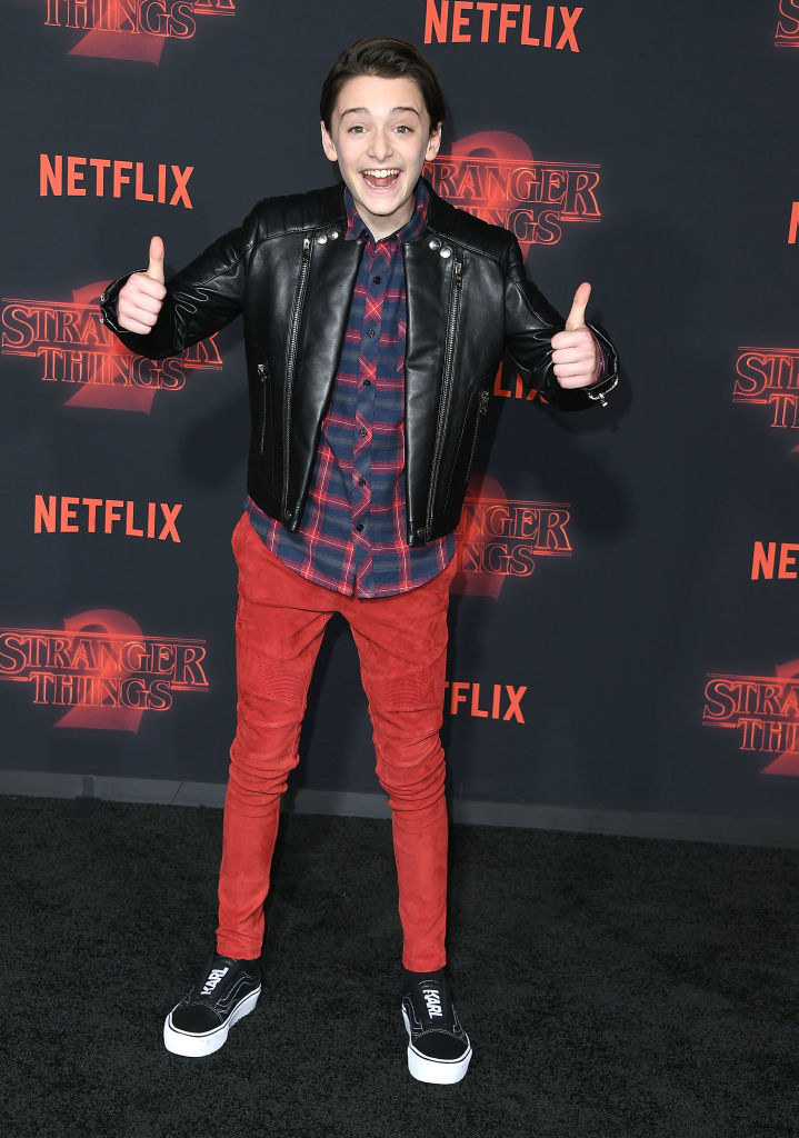 Noah sporting a leather jacket and two thumbs up