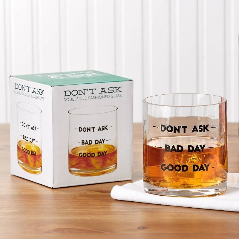 the cocktail glass with measurement markings from bottom to top reading &quot;good day&quot;, &quot;bad day&quot; and &quot;don&#x27;t ask&quot;