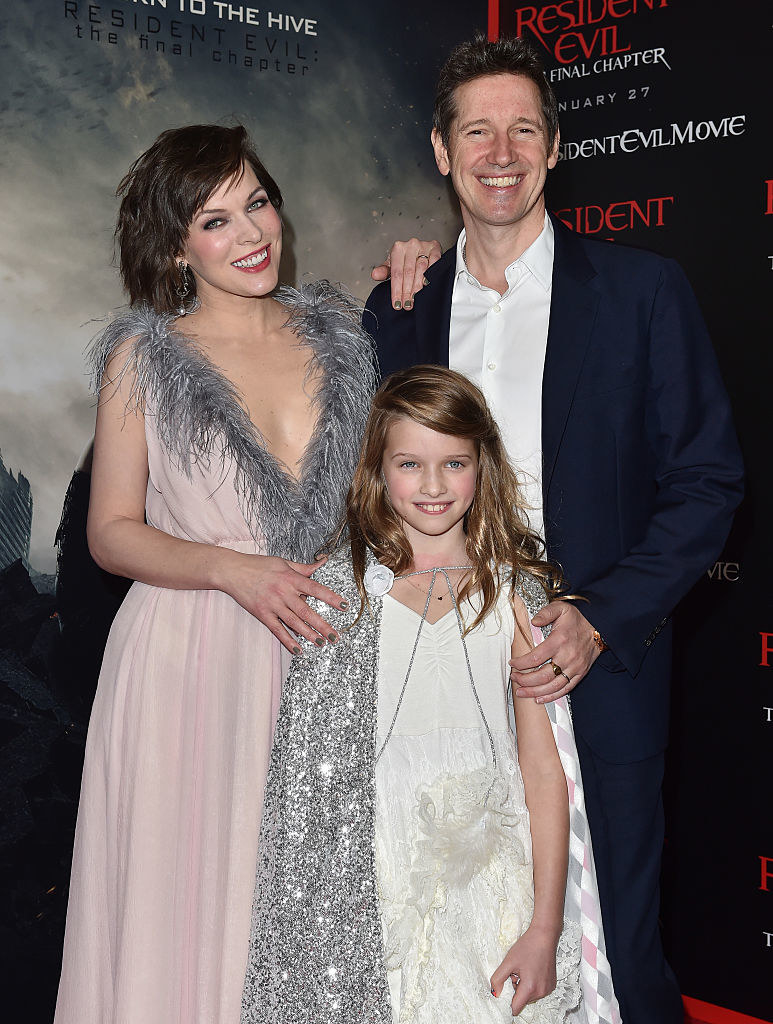 A family photo of Ever, Milla, and Paul together on a red carpet