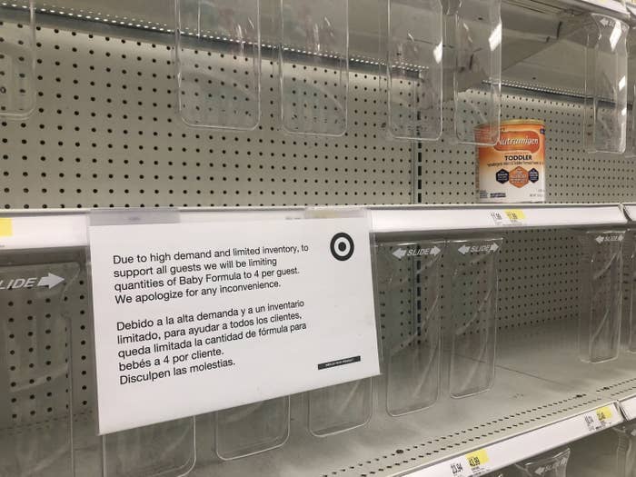 empty formula shelf with a sign advising customers that they are limited to buying only four containers each