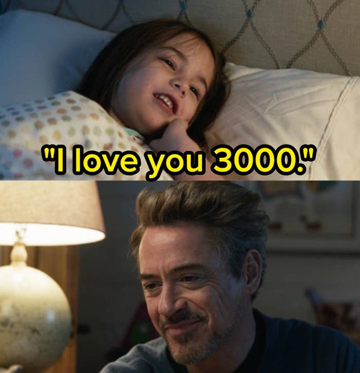 Morgan Stark lays in bed while Tony Stark smiles at her