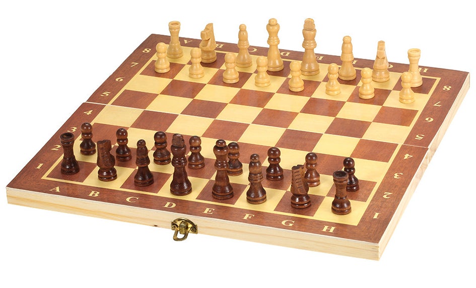 a wood chess board with light and dark wood pieces