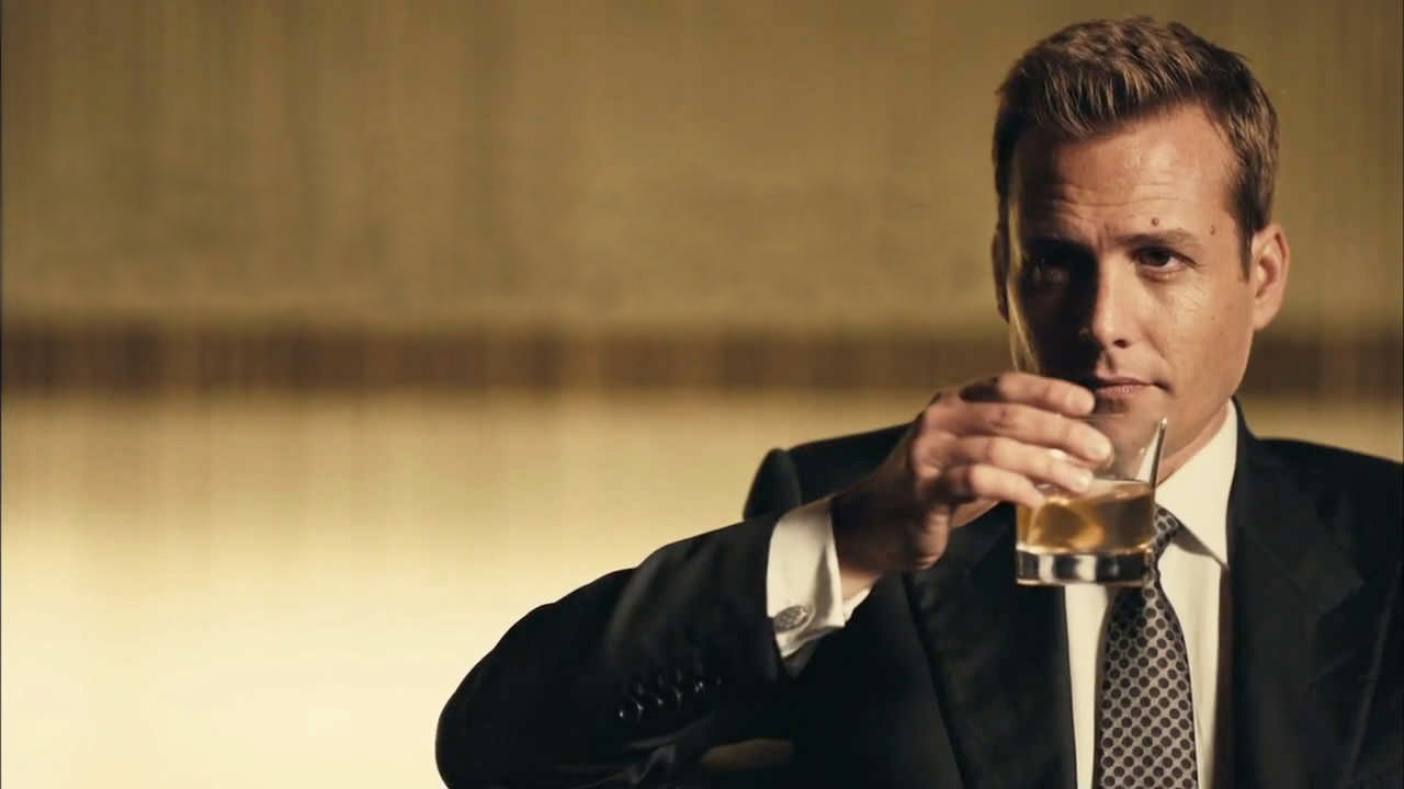 Gabriel Macht as Harvey Spencer sipping a drink in &quot;Suits&quot;