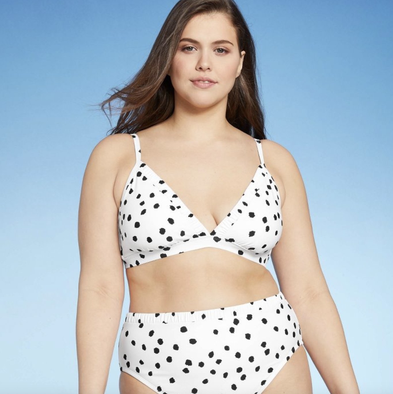 A person wearing a polka dot pattern bikini top and bottom