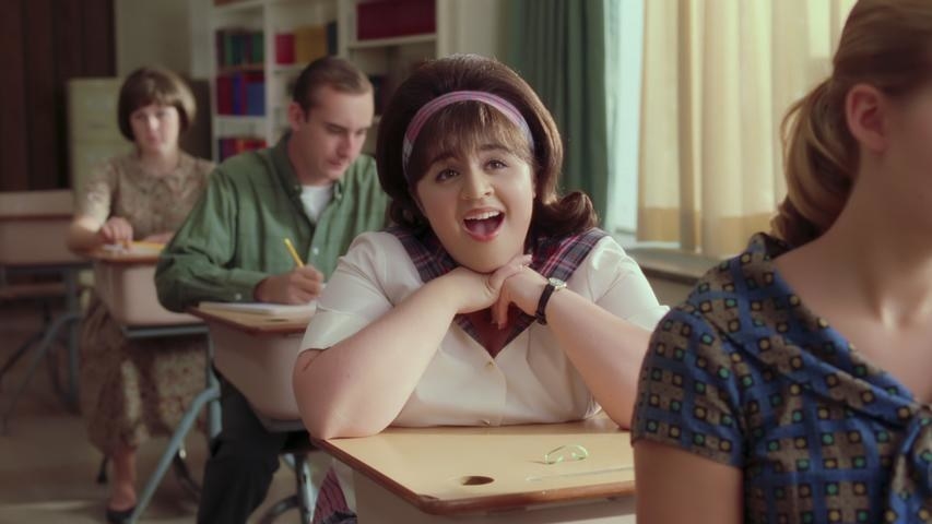 Nikki Blonsky as Tracy Turnblad sitting at her single desk in &quot;Hairspray&quot;