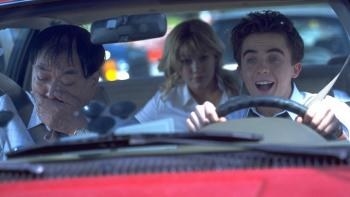 Frankie Muniz as Cody Banks behind the wheel of a car with his driving instructor about to vomit in &quot;Agent Cody Banks&quot;