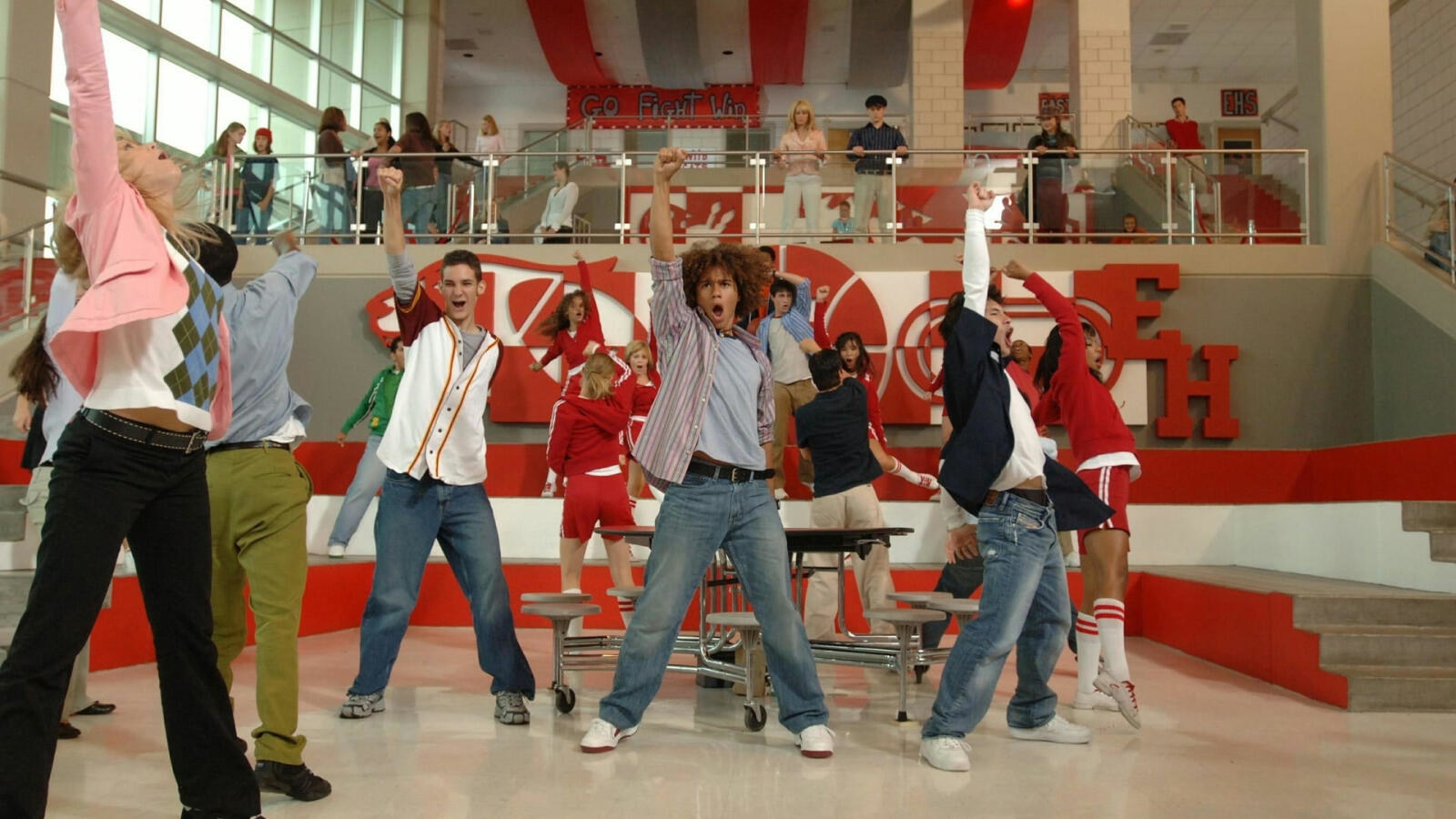 The cast of &quot;High School Musical&quot; all performing a musical number in the canteen