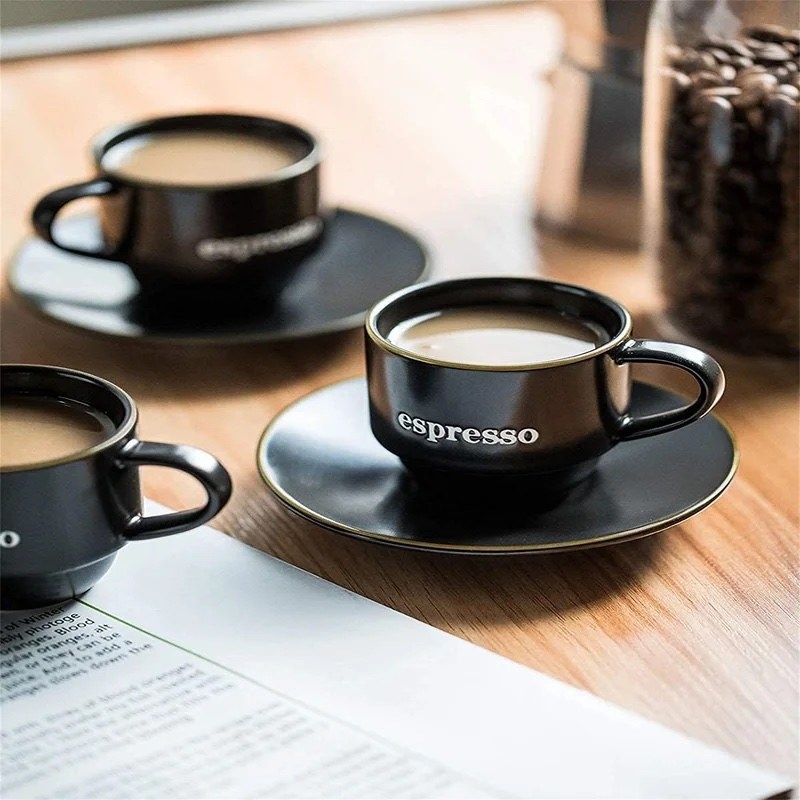 A black mug with white writing that says &quot;espresso&quot;
