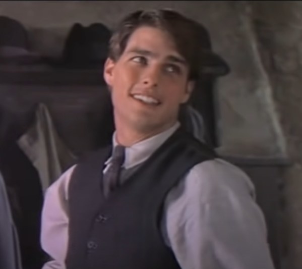 Tom Cruise as Joseph Donnelly looking back at someone smiling