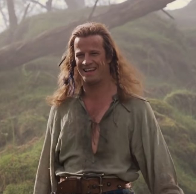 Christopher Lambert as Connor Mcleod smiling at his trainer