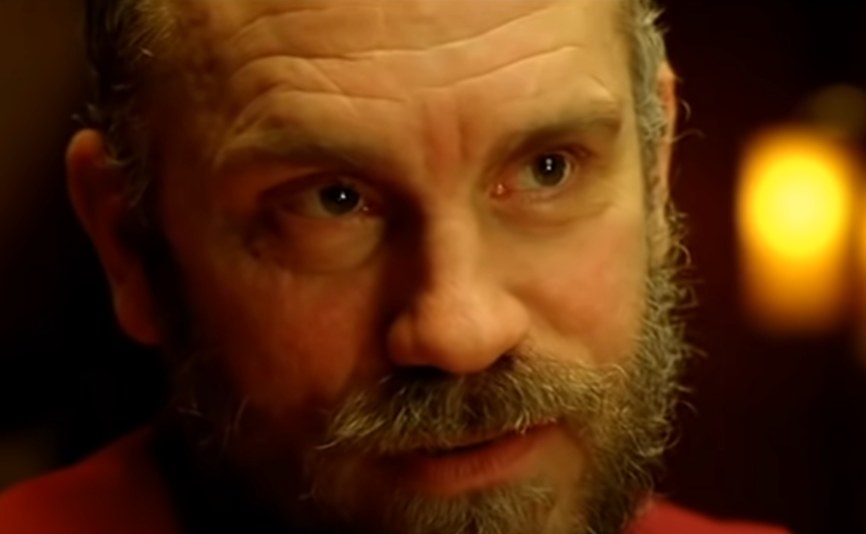 John Malkovich as Teddy looking at someone