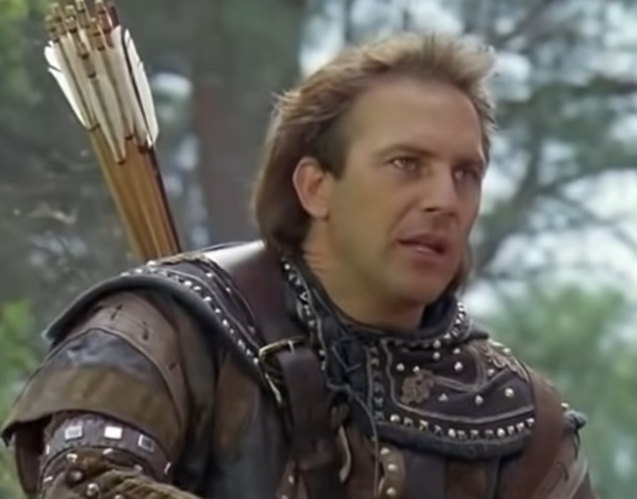 Kevin Costner as Robin Hood speaking to a group of men
