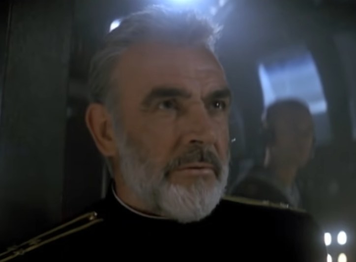 Sean Connery as Captain Marko Ramius looking at a someone in the submarine